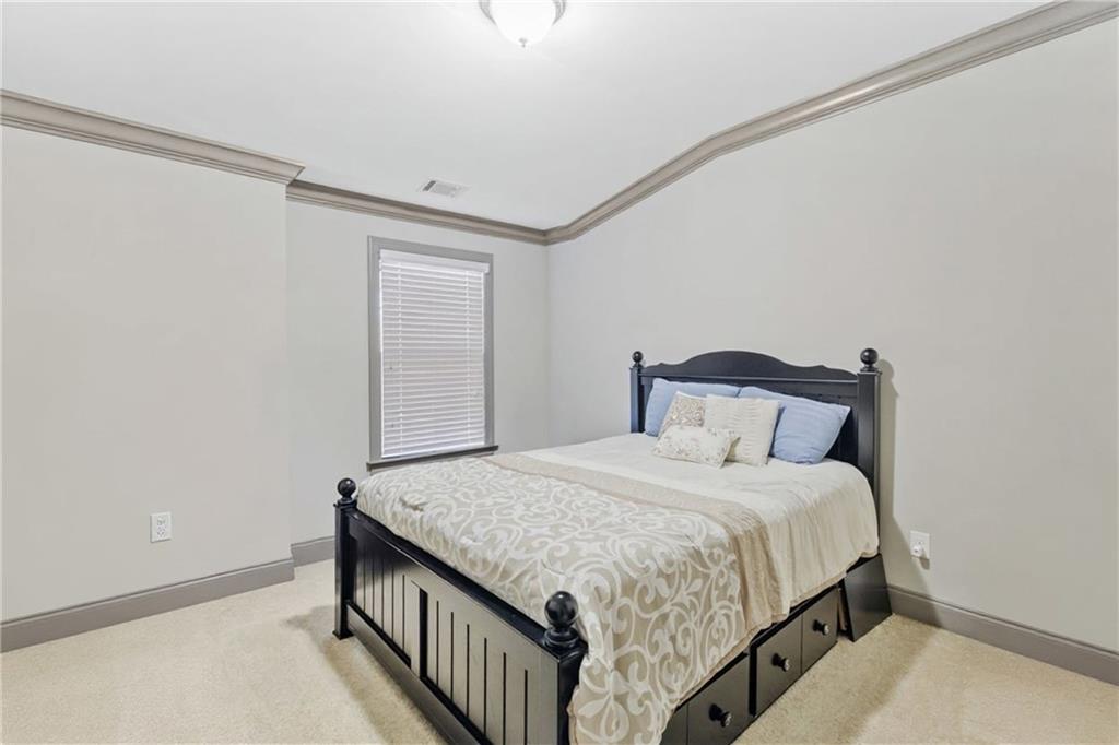 1802 Stephanie Trail Northeast Atlanta, GA 30329 - Photo 25 of 25 a bedroom with a bed and a window