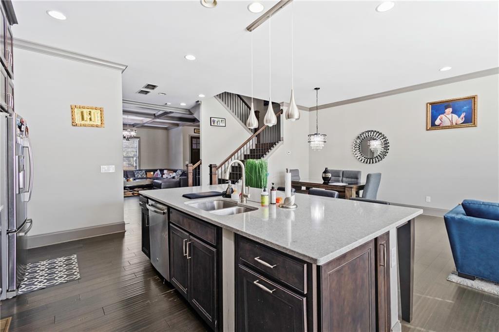 1802 Stephanie Trail Northeast Atlanta, GA 30329 - Photo 5 of 25 a kitchen with a table chairs and a refrigerator