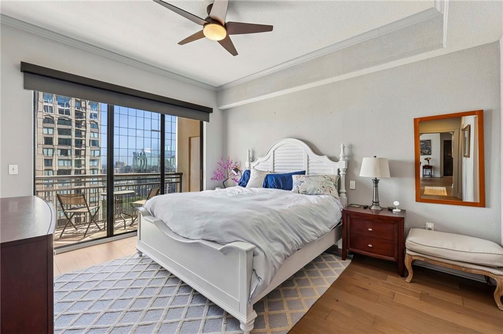 3445 Stratford Road Northeast, Unit 3105 Atlanta, GA 30326 - Photo 20 of 47 a bedroom with a large bed and a large window