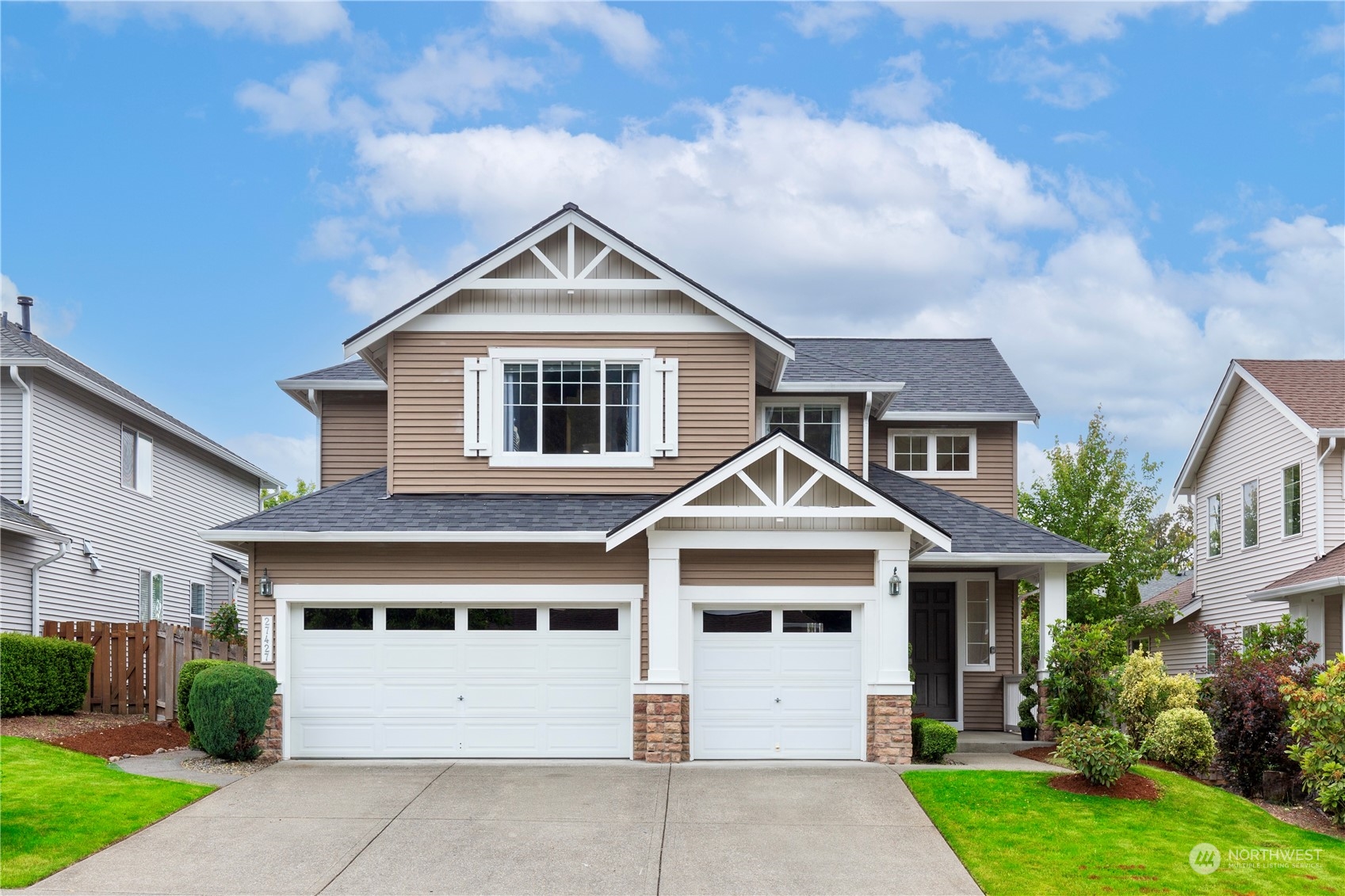 27427 Maple Ridge Way Southeast Maple Valley, WA 98038 - Photo 1 of 37 a front view of a house with a yard