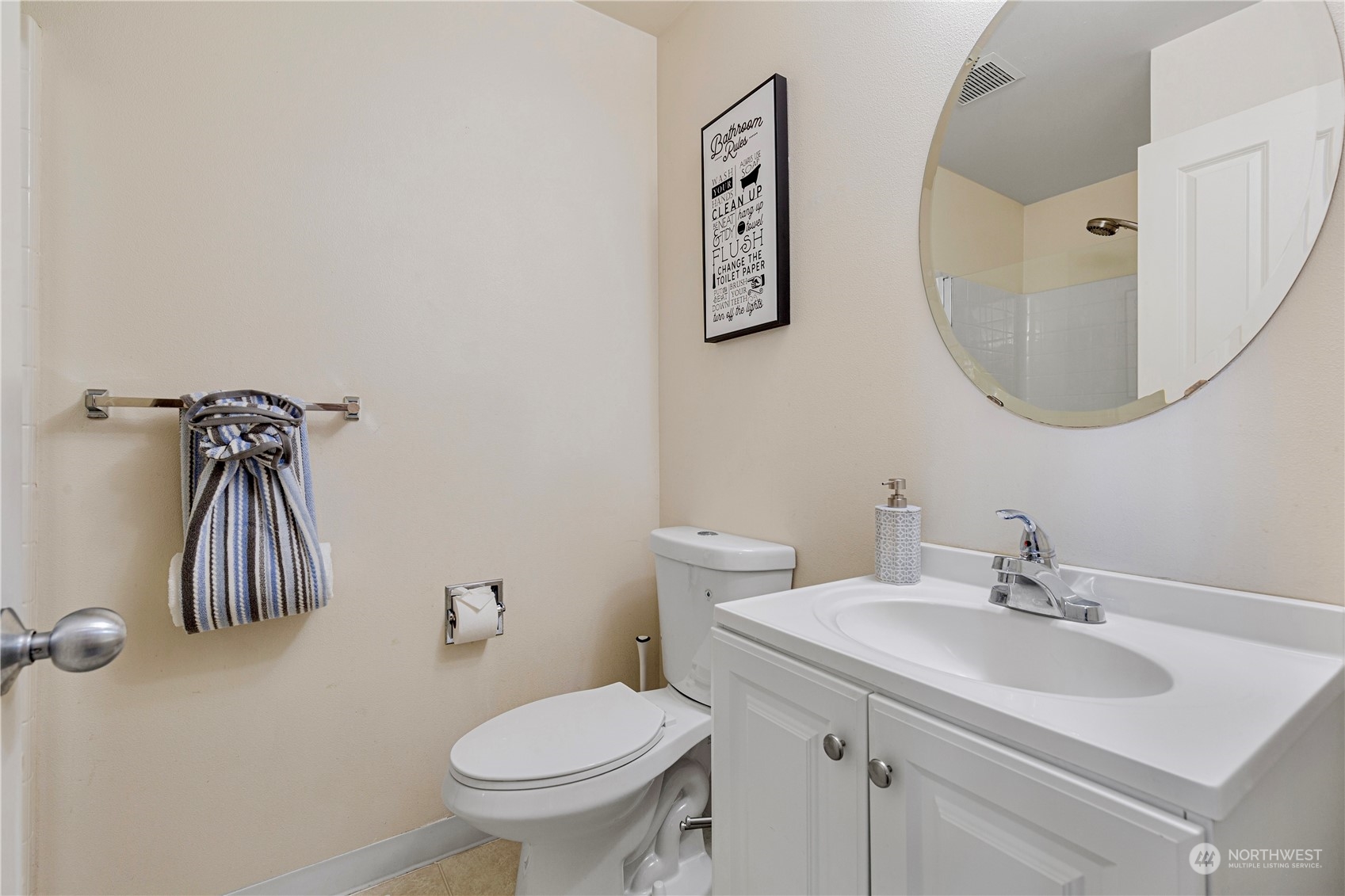 27427 Maple Ridge Way Southeast Maple Valley, WA 98038 - Photo 24 of 37 a bathroom with a toilet sink and mirror