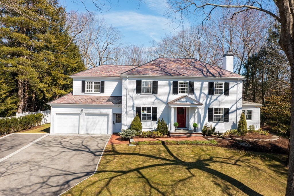 61 Arnold Road Wellesley, MA 02481 - Photo 1 of 1 a front view of a house with yard and trees