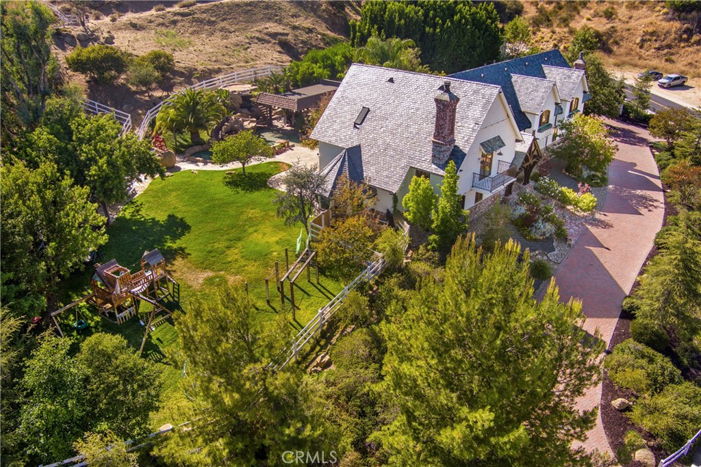 85 Saddlebow Road Bell Canyon, CA 91307 - Photo 72 of 75 an aerial view of a house with a yard and garden in back