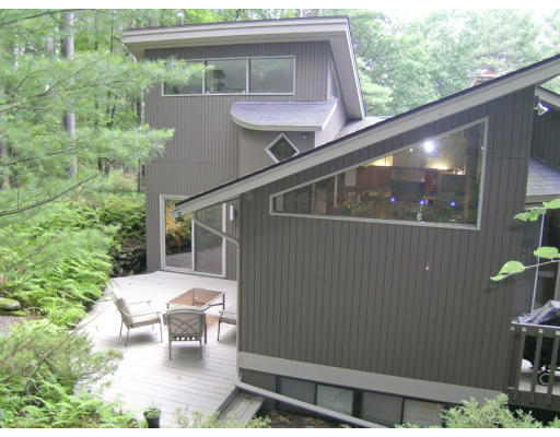 a side view of a house with a yard