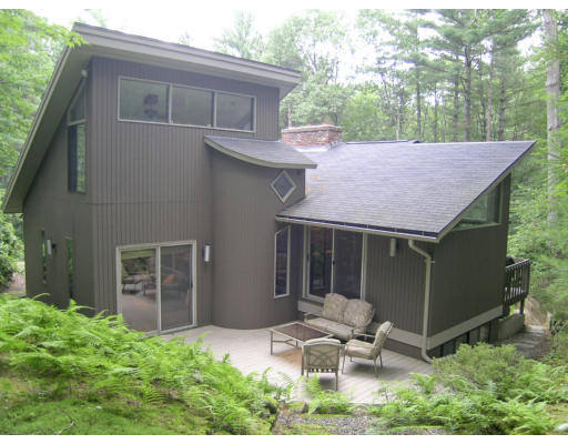 49 Campbell Road Wayland, MA 01778 - Photo 15 of 15 a backyard of a house with table and chairs