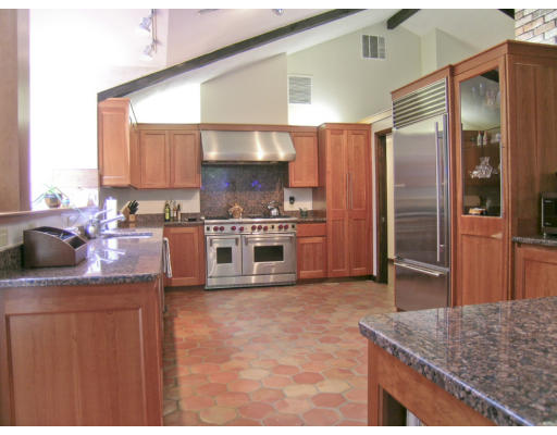 49 Campbell Road Wayland, MA 01778 - Photo 2 of 15 a kitchen with stainless steel appliances granite countertop a sink stove and refrigerator