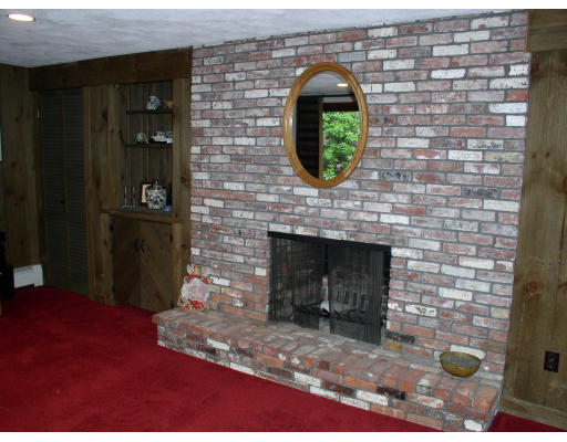 49 Campbell Road Wayland, MA 01778 - Photo 9 of 15 a front view of a house with a fireplace