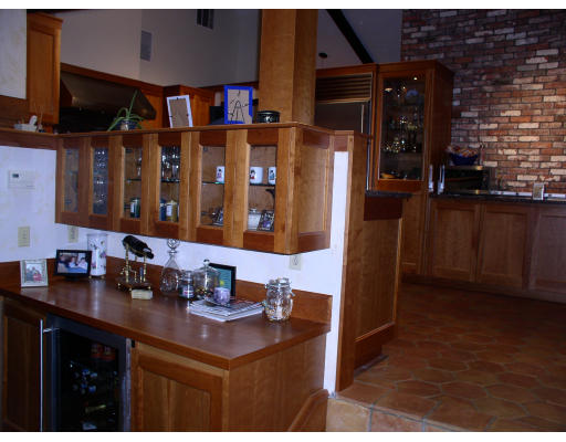 49 Campbell Road Wayland, MA 01778 - Photo 10 of 15 a kitchen with stainless steel appliances kitchen island granite countertop a sink and cabinets