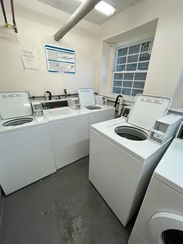 a view of kitchen sink and dishwasher with wooden floor