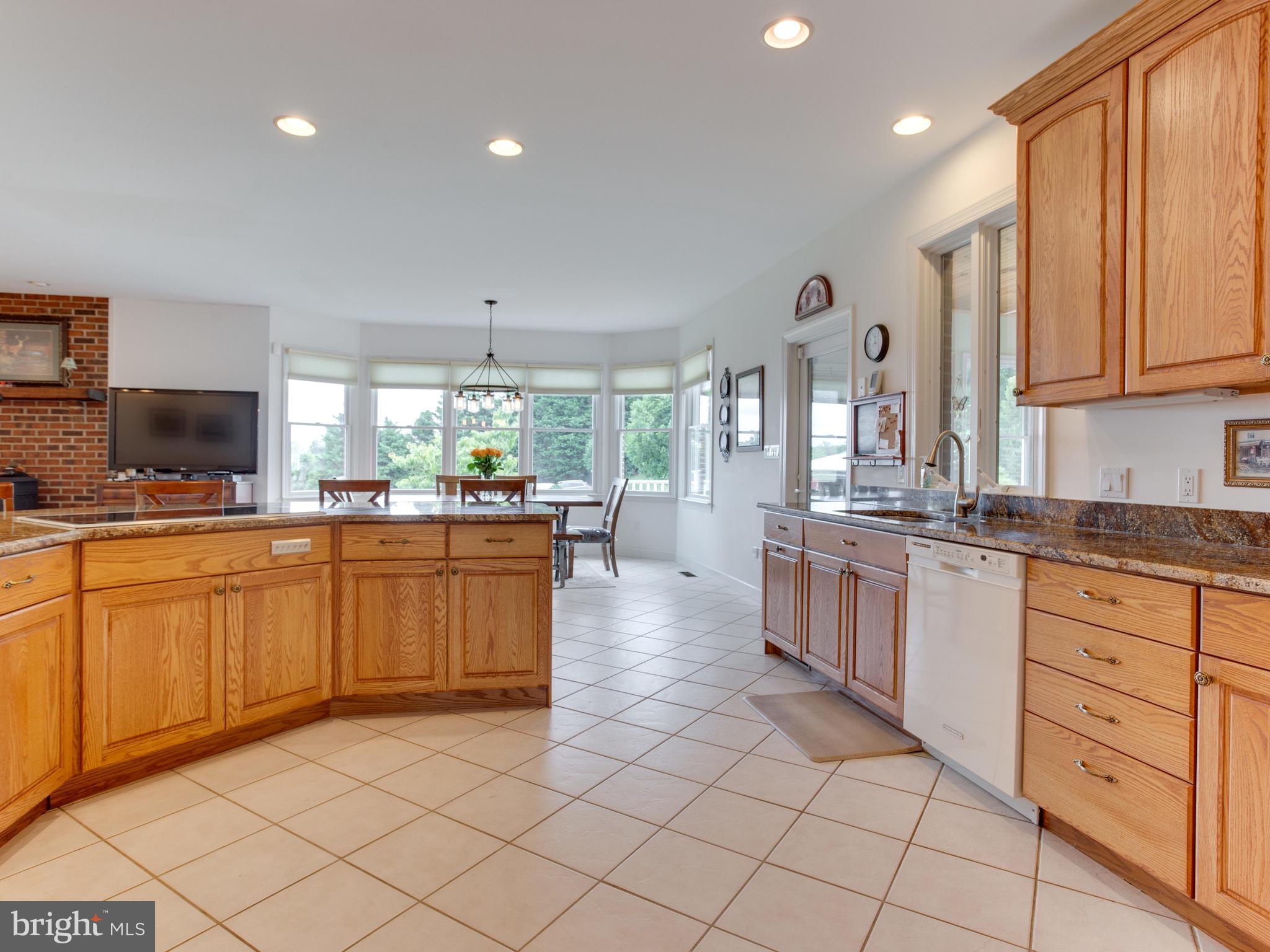 5970 Little Road Lothian, MD 20711 - Photo 18 of 60 Kitchen sweeps into dining area, how easy is that!