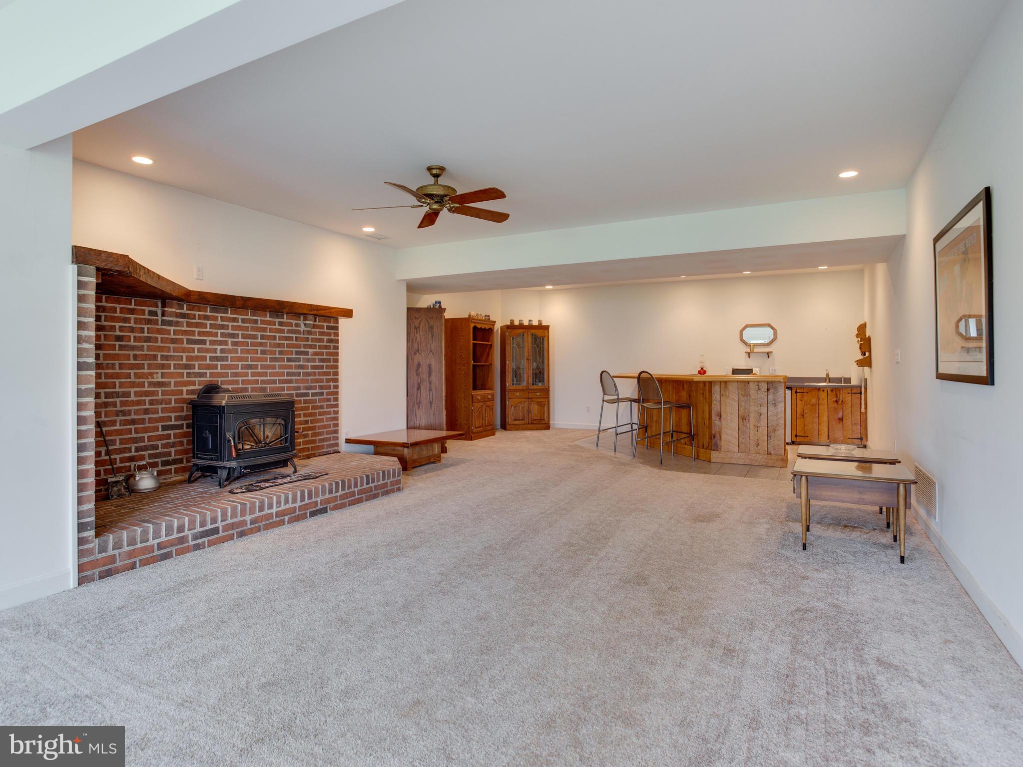 5970 Little Road Lothian, MD 20711 - Photo 39 of 60 Basement Bar, Wood Stove, Lots of Room!
