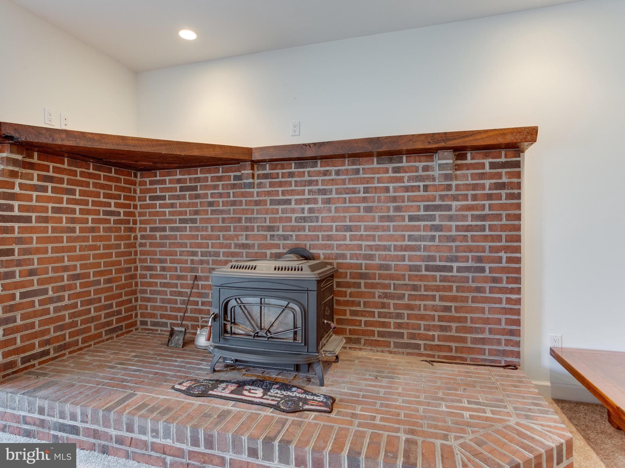 5970 Little Road Lothian, MD 20711 - Photo 40 of 60 Wood Stove surrounded by hand-laid brick!