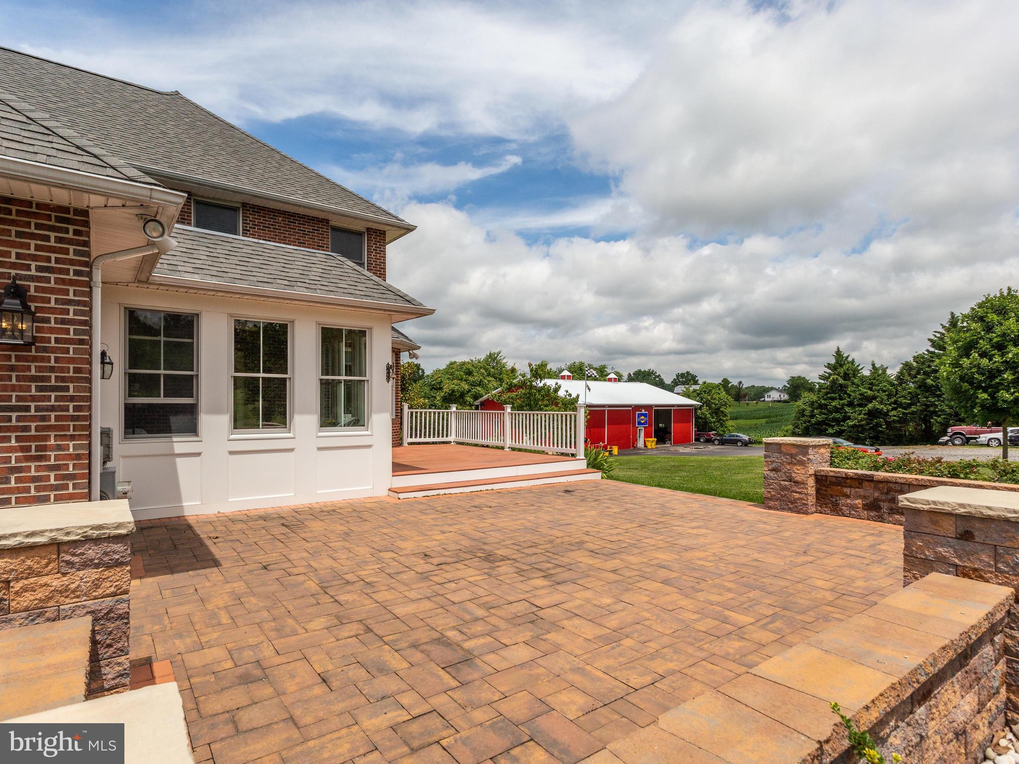 5970 Little Road Lothian, MD 20711 - Photo 7 of 60 Custom built patio graces the front entry.