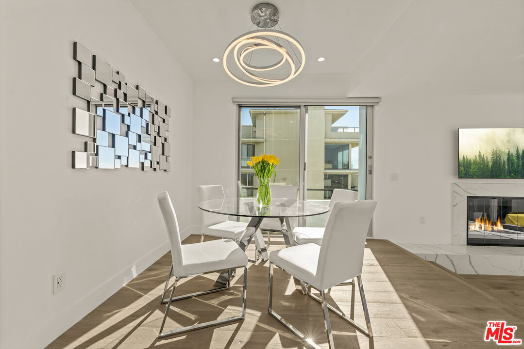 1 Eastwind Street, Unit 201 Marina del Rey, CA 90292 - Photo 13 of 40 a view of a dining room with furniture and a table