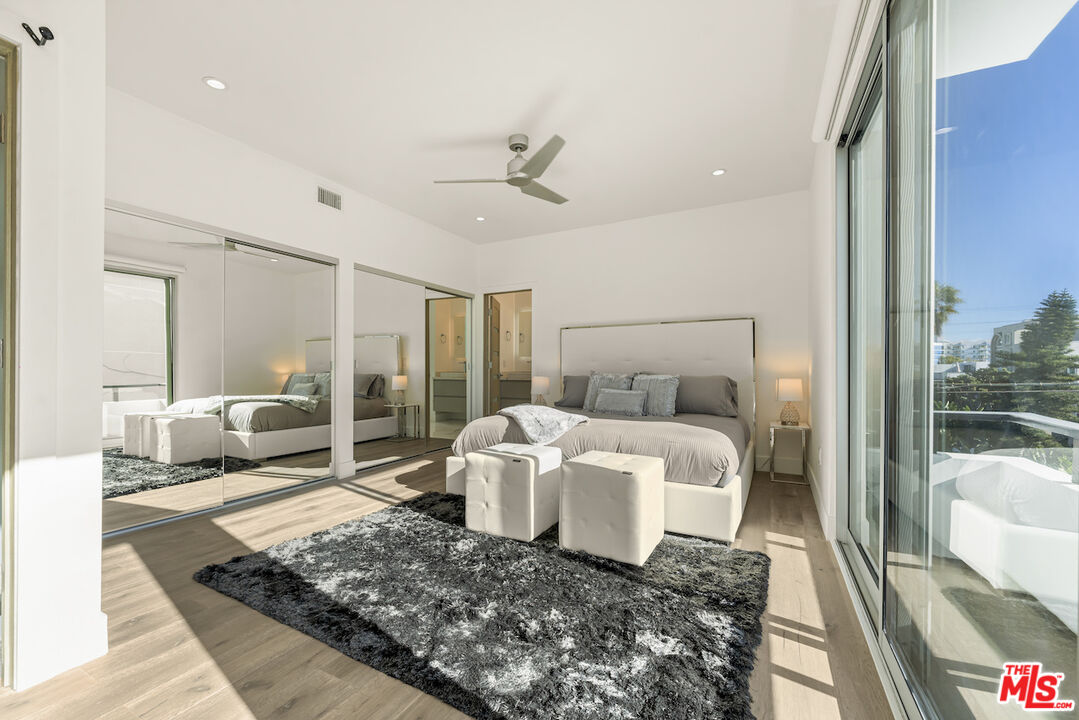 1 Eastwind Street, Unit 201 Marina del Rey, CA 90292 - Photo 15 of 40 a large white bed sitting in a bedroom next to a window