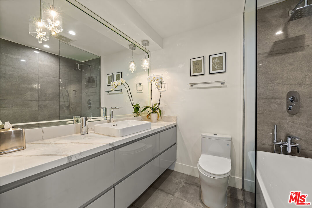 1 Eastwind Street, Unit 201 Marina del Rey, CA 90292 - Photo 19 of 40 a bathroom with a toilet sink and mirror