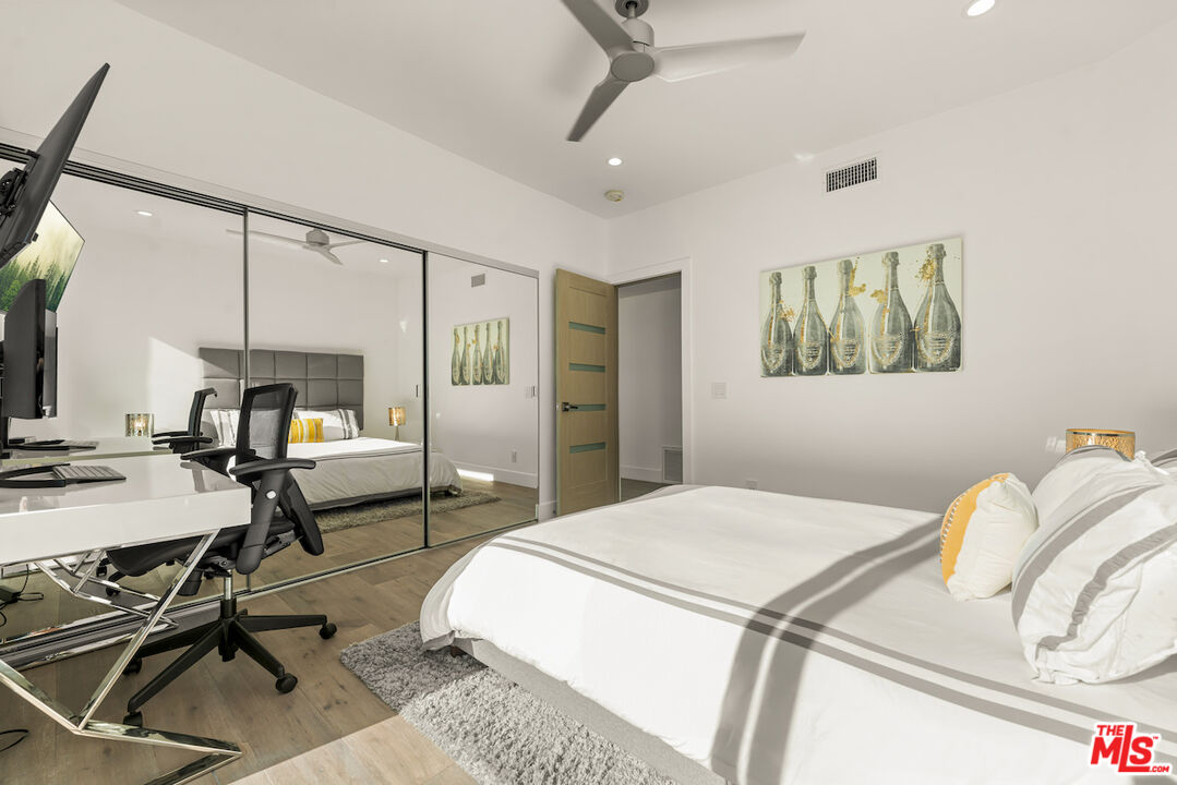 1 Eastwind Street, Unit 201 Marina del Rey, CA 90292 - Photo 23 of 40 a bedroom with a bed and a table