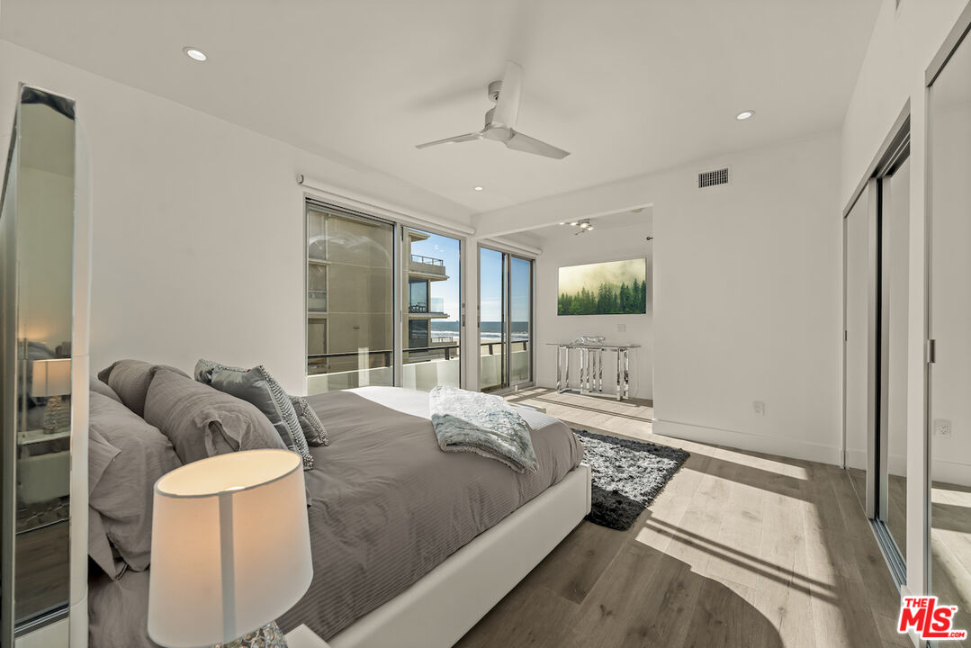 1 Eastwind Street, Unit 201 Marina del Rey, CA 90292 - Photo 25 of 40 a bedroom with a bed and window
