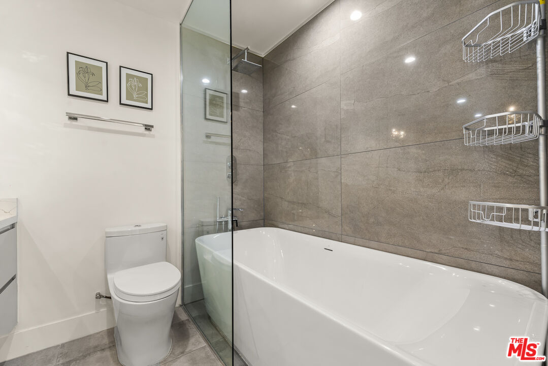 1 Eastwind Street, Unit 201 Marina del Rey, CA 90292 - Photo 28 of 40 a bathroom with a toilet a sink and bathtub