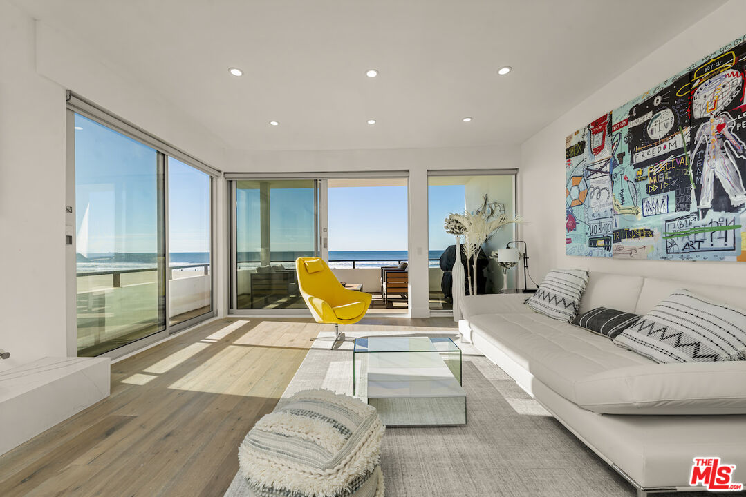 1 Eastwind Street, Unit 201 Marina del Rey, CA 90292 - Photo 3 of 40 a living room with furniture and wooden floor