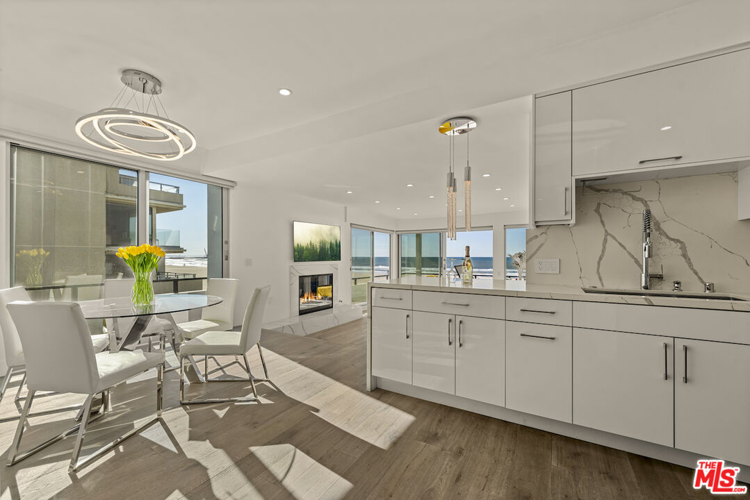 1 Eastwind Street, Unit 201 Marina del Rey, CA 90292 - Photo 5 of 40 a kitchen with a sink cabinets and window