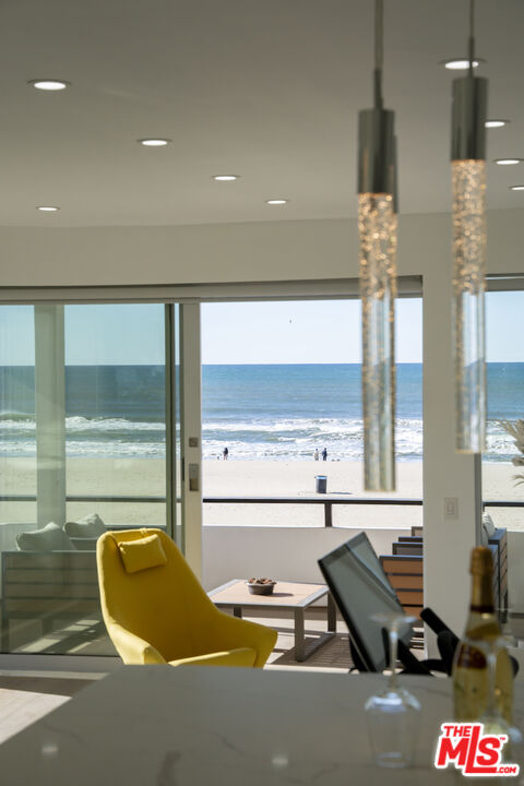 1 Eastwind Street, Unit 201 Marina del Rey, CA 90292 - Photo 10 of 40 a room with gym equipment and a large window