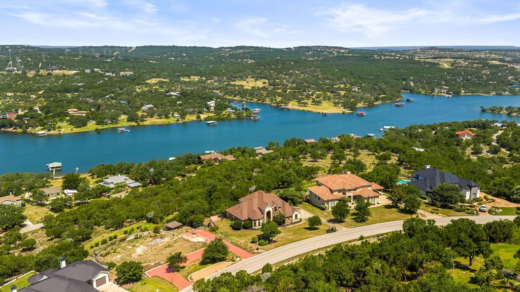 2702 Lakehurst Road Spicewood, TX 78669 - Photo 40 of 40 Perched above the water, this estate boasts a beautiful pool and ample outdoor living space.