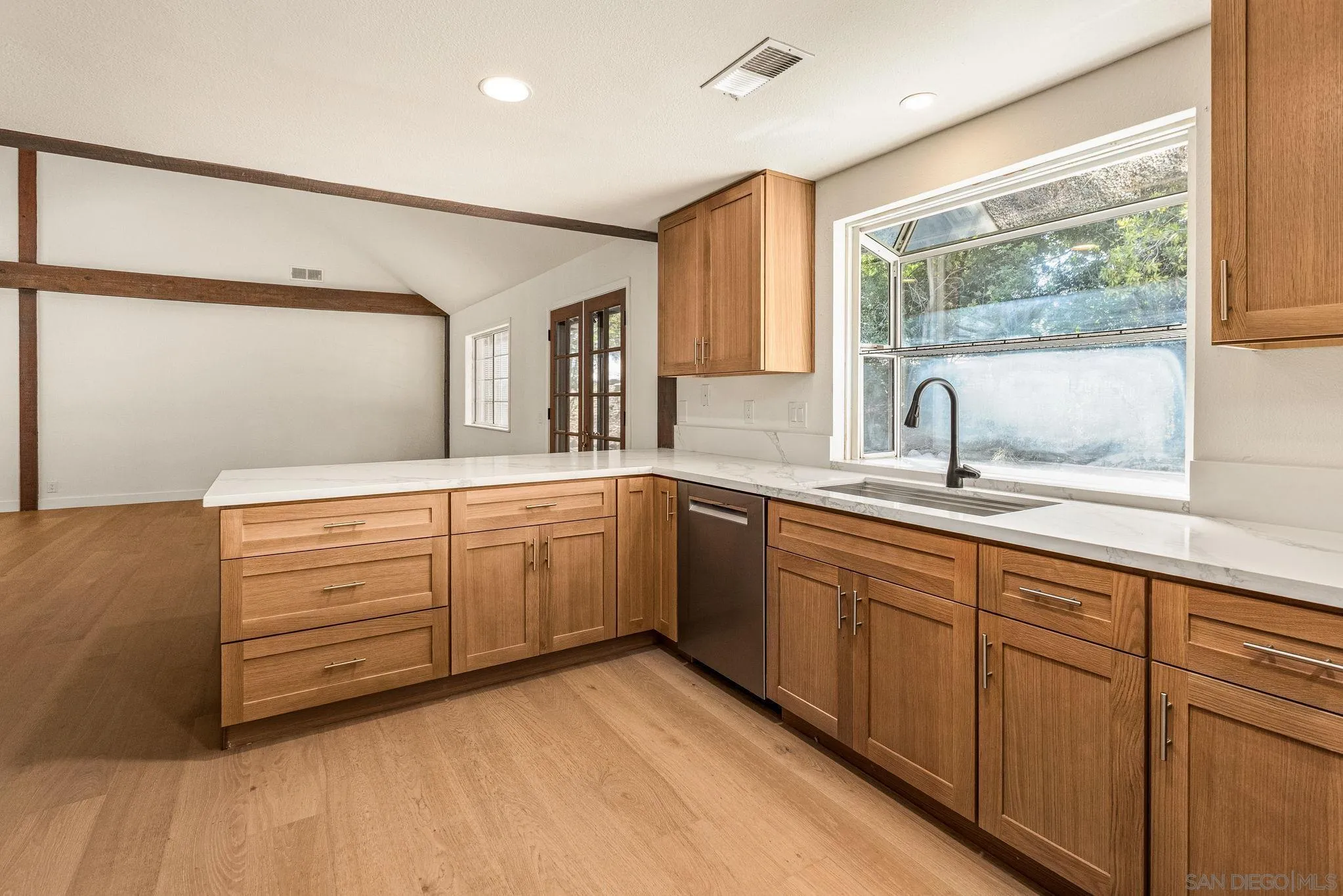2029 Winterwarm Drive Fallbrook, CA 92028 - Photo 22 of 36 a spacious bathroom with a double vanity sink a mirror and a bathtub