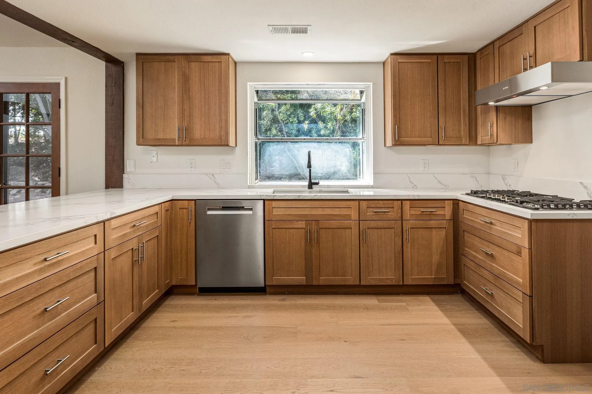 2029 Winterwarm Drive Fallbrook, CA 92028 - Photo 23 of 36 a kitchen with a sink stove and cabinets
