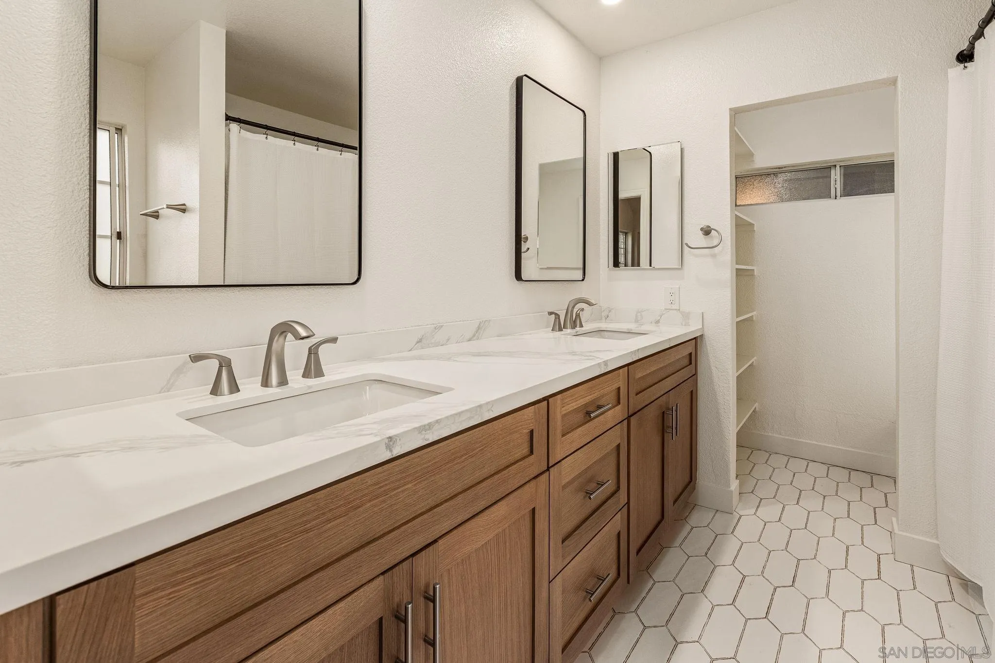2029 Winterwarm Drive Fallbrook, CA 92028 - Photo 28 of 36 a bathroom with a double vanity sink mirror and