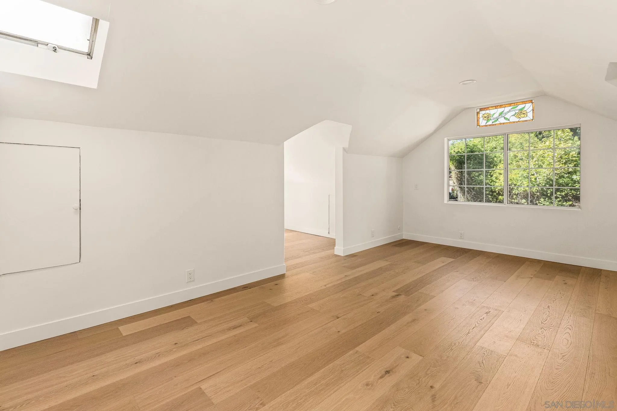 2029 Winterwarm Drive Fallbrook, CA 92028 - Photo 35 of 36 an empty room with wooden floor and window