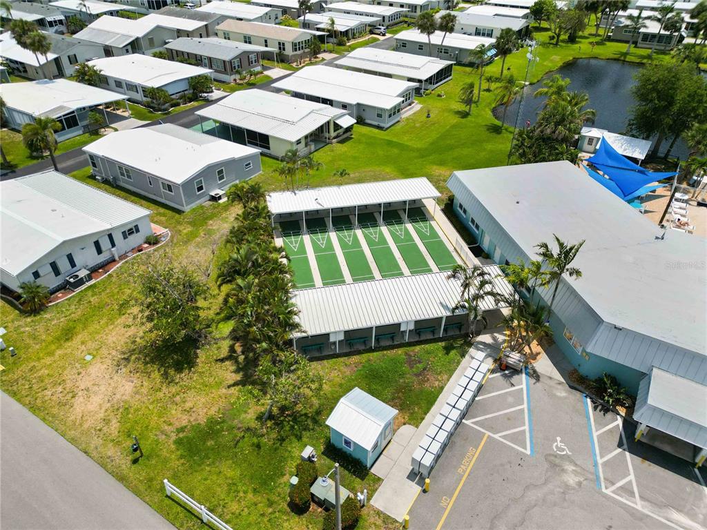 10303 Burnt Store Road, Unit 54 Punta Gorda, FL 33950 - Photo 21 of 27 an aerial view of a house with a garden and swimming pool