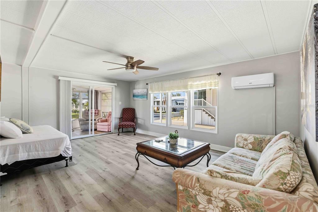 10303 Burnt Store Road, Unit 54 Punta Gorda, FL 33950 - Photo 9 of 27 a living room with furniture and wooden floor
