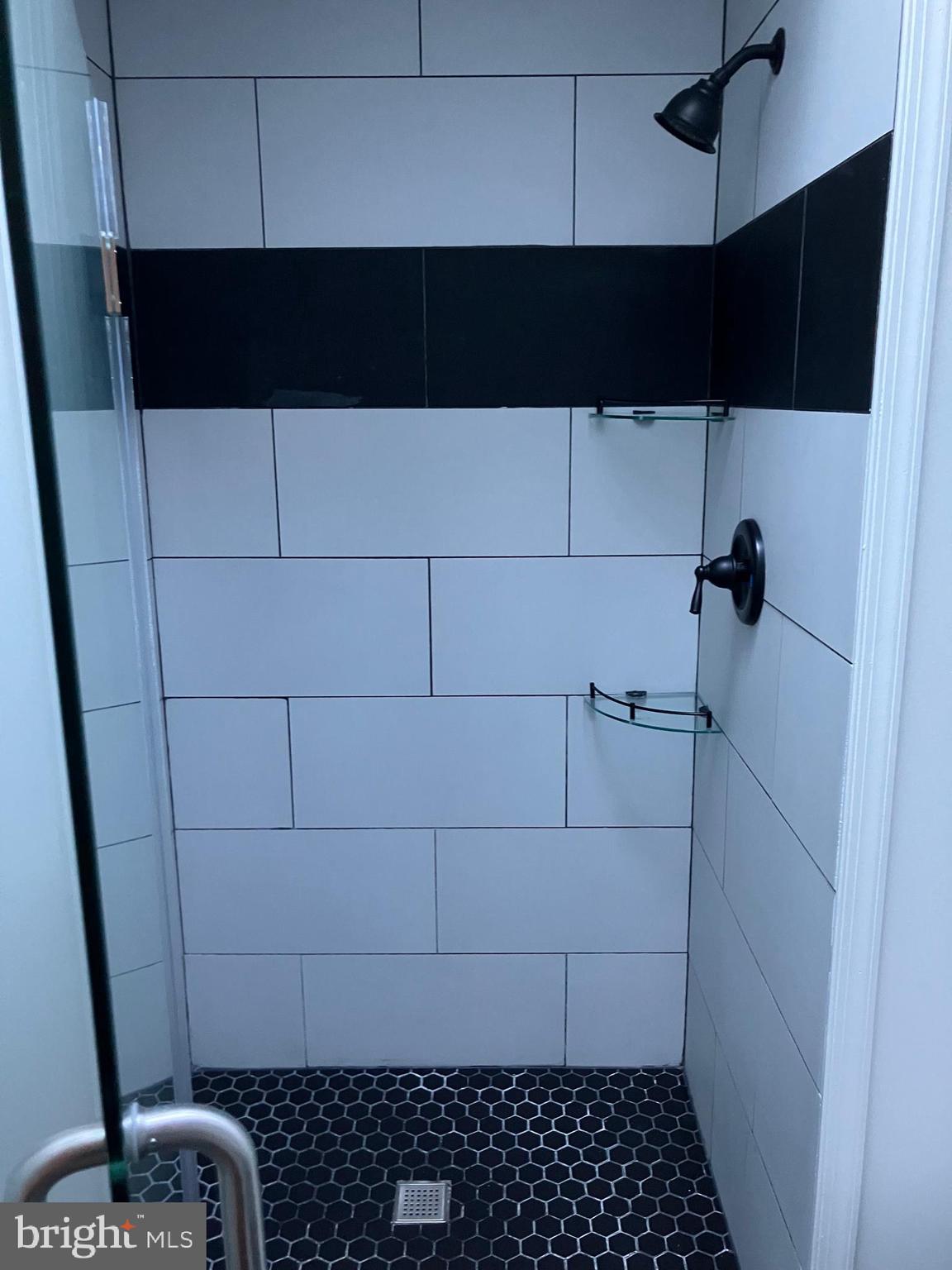 3014 Memphis Street Philadelphia, PA 19134 - Photo 11 of 15 a bathroom with a black and white shower