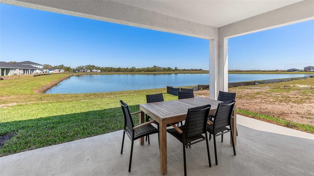1709 Cobb Trail Parrish, FL 34219 - Photo 25 of 26 a view of an ocean from a balcony with outdoor seating