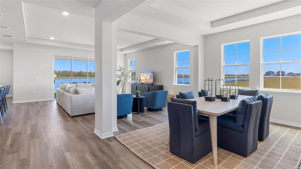 1709 Cobb Trail Parrish, FL 34219 - Photo 9 of 26 a view of a dining room with furniture window and wooden floor