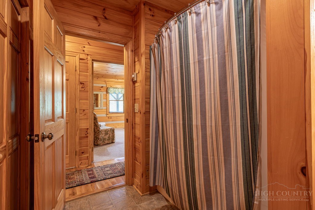 197 Woodby Ridge Road Vilas, NC 28692 - Photo 22 of 45 a view of a bathroom with a shower