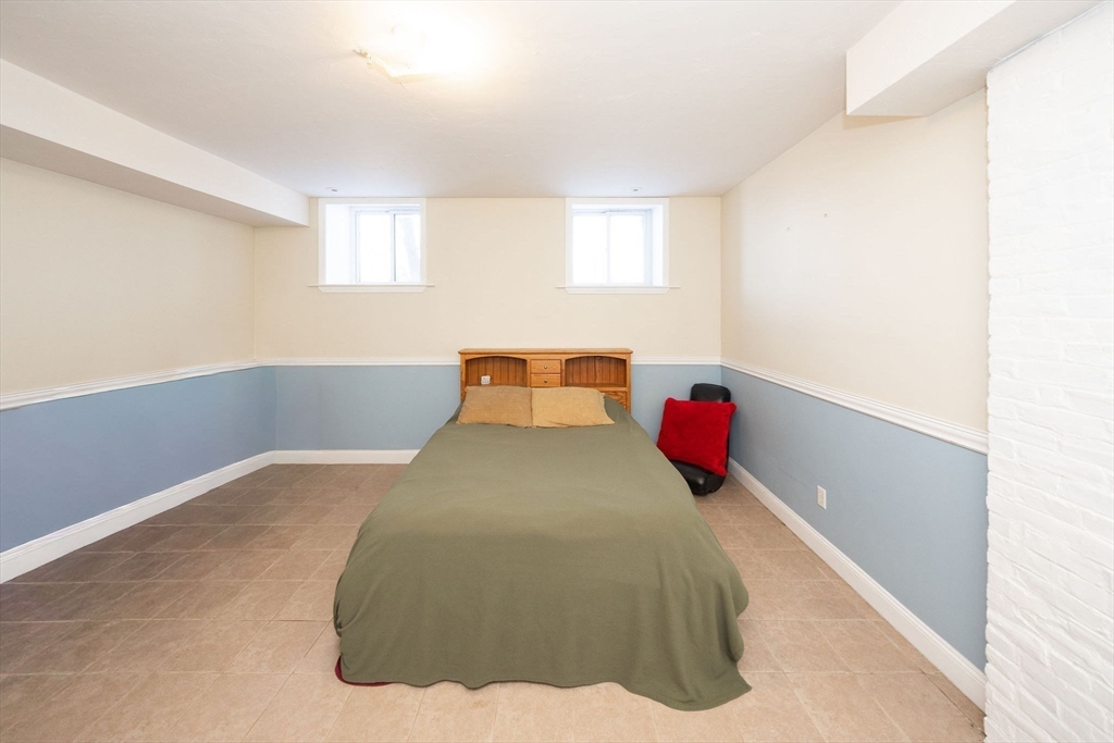 32 Providence Street, Unit 5 Worcester, MA 01604 - Photo 22 of 42 a bedroom with a bed and window