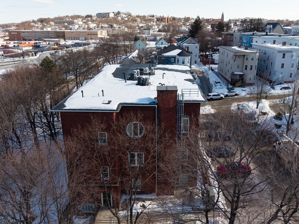 32 Providence Street, Unit 5 Worcester, MA 01604 - Photo 35 of 42 a view of a house with a yard