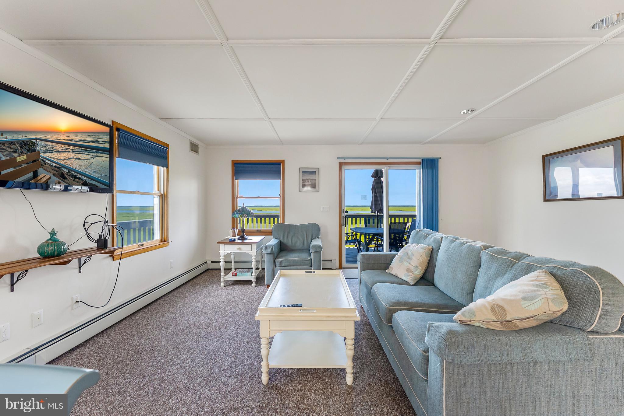 6500 Central Avenue, Unit SOUTH Sea Isle City, NJ 08243 - Photo 14 of 54 a living room with furniture and a large window