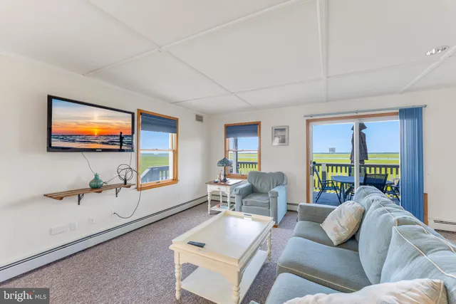 a very nice looking room with lots of furniture and windows