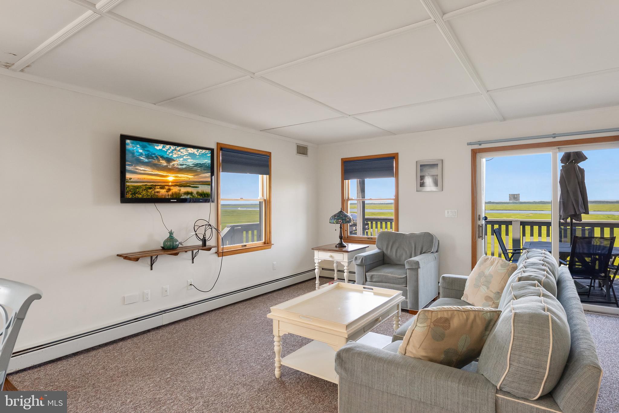 6500 Central Avenue, Unit SOUTH Sea Isle City, NJ 08243 - Photo 20 of 54 a living room with furniture a window and a flat screen tv