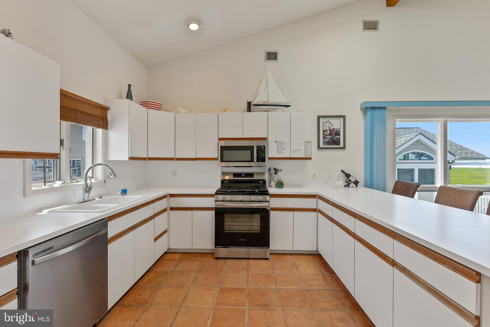 6500 Central Avenue, Unit SOUTH Sea Isle City, NJ 08243 - Photo 25 of 54 a large kitchen with a sink and cabinets