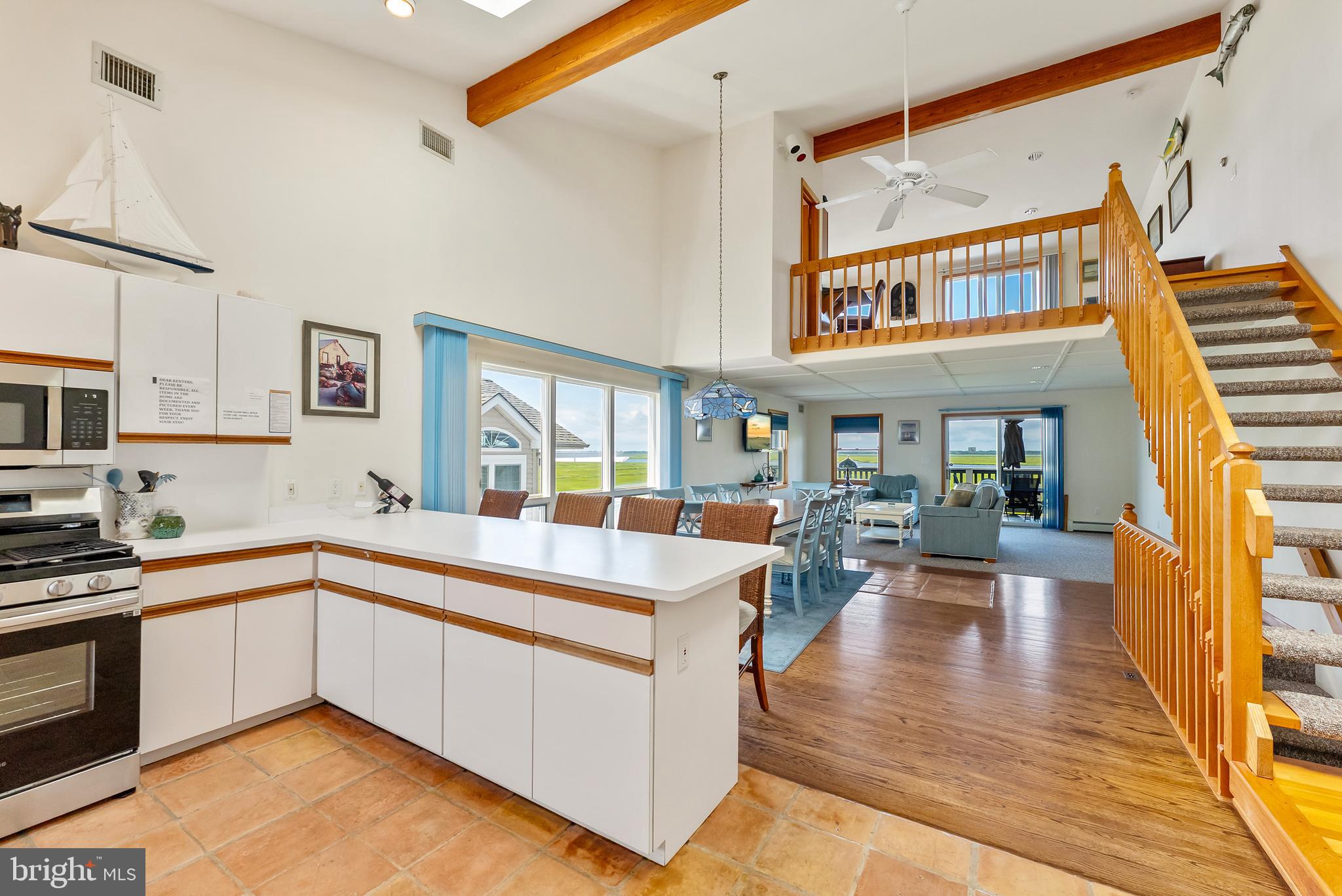 6500 Central Avenue, Unit SOUTH Sea Isle City, NJ 08243 - Photo 26 of 54 a large white kitchen with a large window