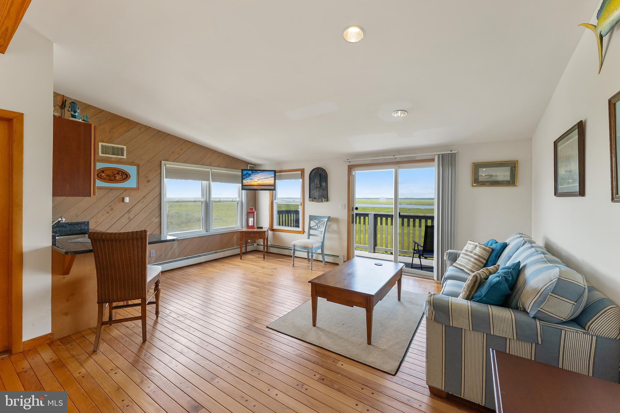 6500 Central Avenue, Unit SOUTH Sea Isle City, NJ 08243 - Photo 31 of 54 a living room with furniture and a wooden floor