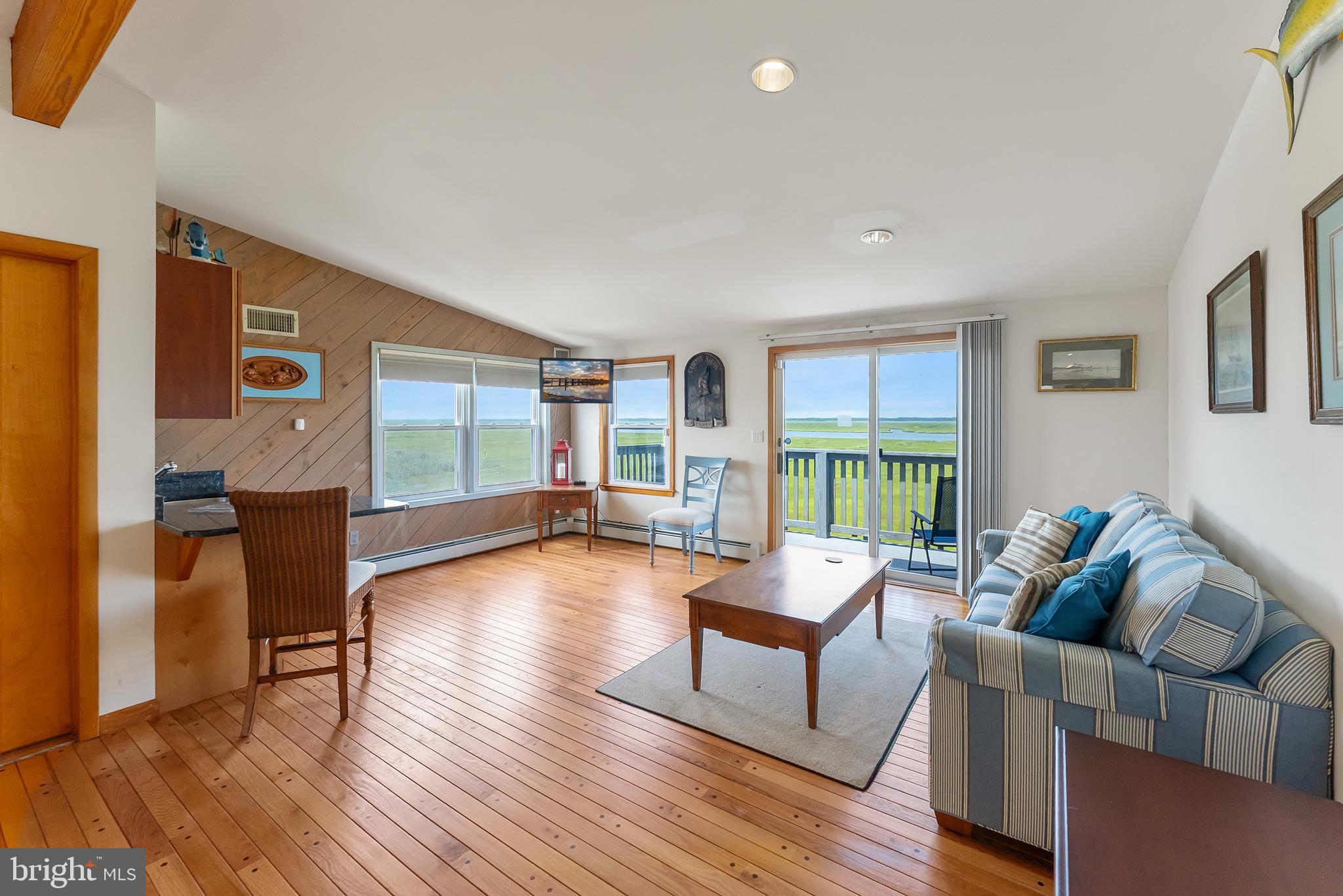 6500 Central Avenue, Unit SOUTH Sea Isle City, NJ 08243 - Photo 32 of 54 a living room with furniture and a wooden floor