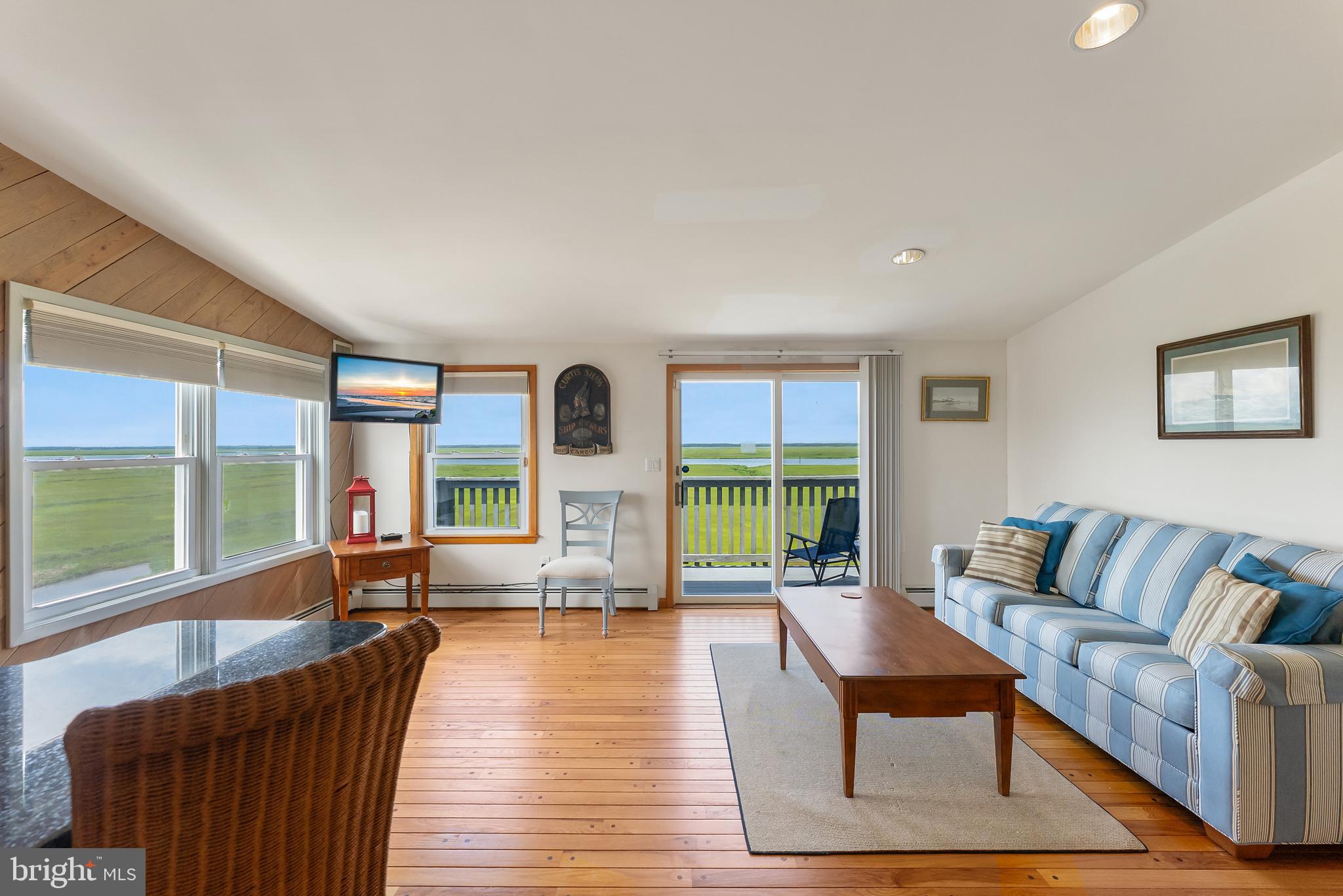 6500 Central Avenue, Unit SOUTH Sea Isle City, NJ 08243 - Photo 33 of 54 a living room with furniture and a large window