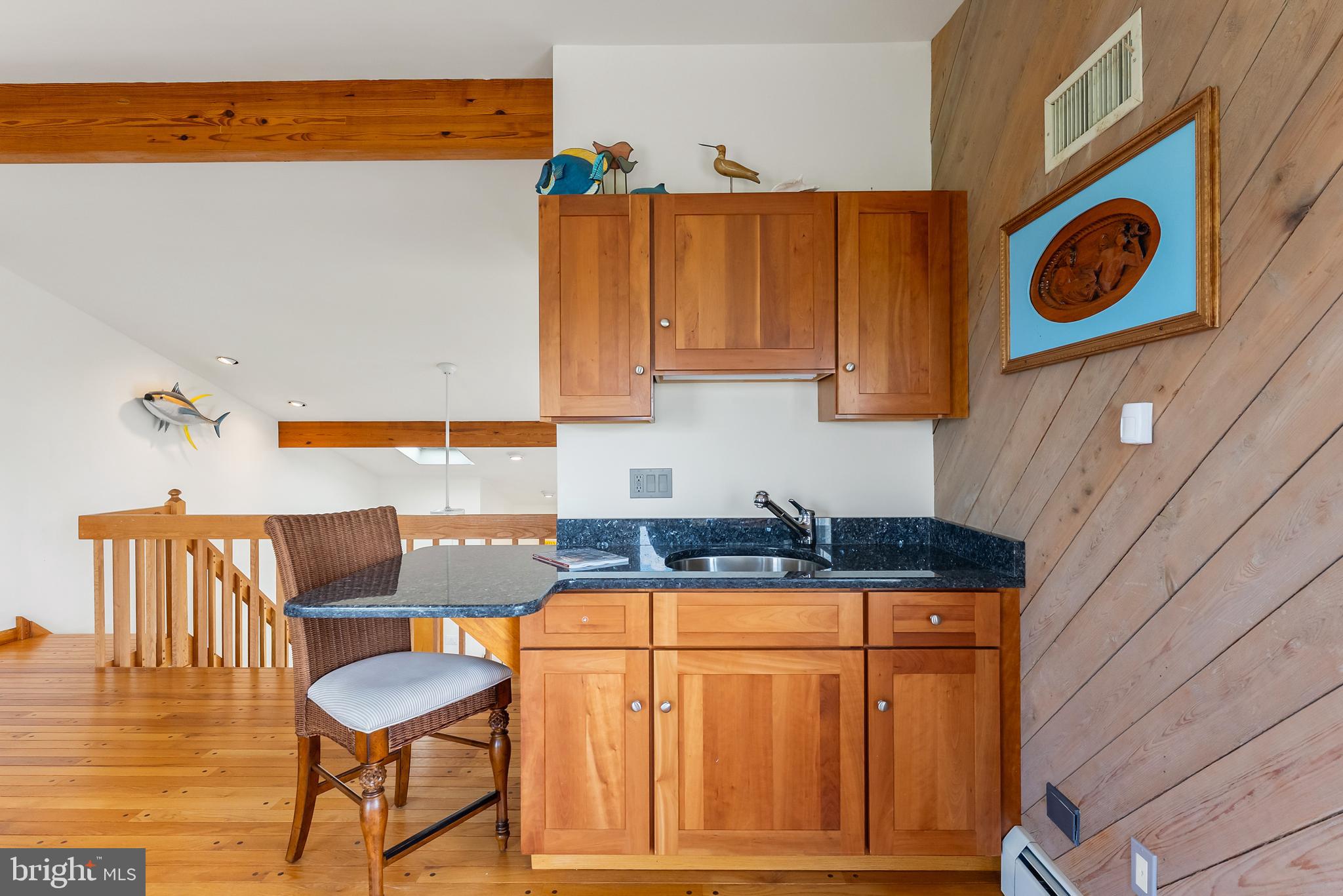 6500 Central Avenue, Unit SOUTH Sea Isle City, NJ 08243 - Photo 36 of 54 a kitchen with stainless steel appliances granite countertop a stove and a refrigerator