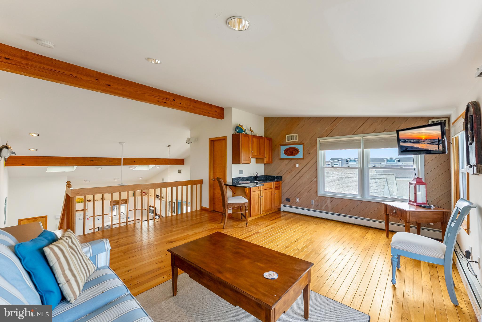 6500 Central Avenue, Unit SOUTH Sea Isle City, NJ 08243 - Photo 41 of 54 a living room with furniture pool table wooden floor and a large window