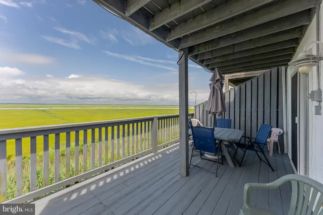 a view of a balcony with furniture